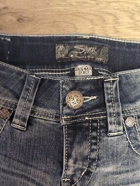 Silver Jeans Women's Light Blue Faded Jeans with Decorative Button And Crystal